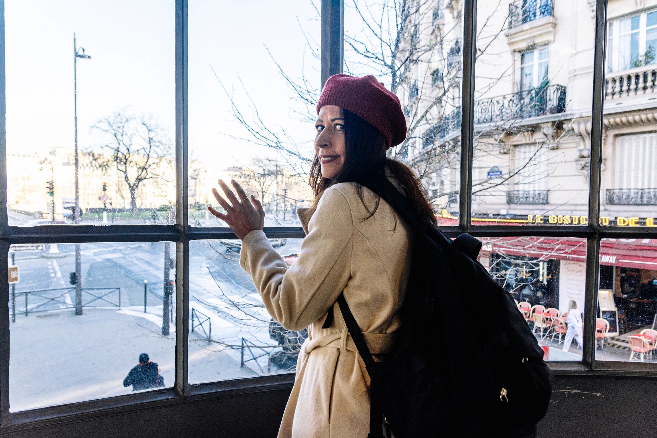 Woman traveler looking out a train window